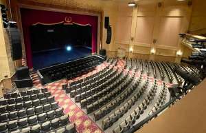 Thumbnail photo of Internal shot of Sunrise Theatre in Fort Pierce from the balcony looking down on empty orchestra seating and stage.